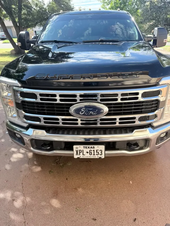 Black Ford Super Duty, front, after a full detail